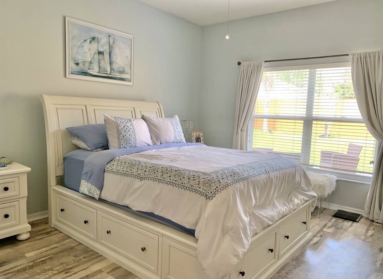 Freshly cleaned bedroom with the bed neatly made